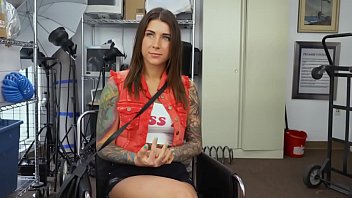 Tattooed teen is sucking a black cock to get done with a fake job interview.