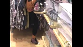 Girlfriend pisses in the clothing store